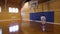 Boy playing indoor basketball alone (1 of 3)