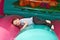 Boy playing on inflatable slide