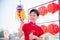 Boy playing lion puppet in chinese new year festival