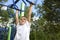 Boy playing on monkey bars