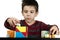 Boy playing with multicolored cubes