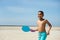 Boy playing paddle ball at the beach