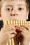 Boy playing panflute