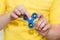 A boy is playing a popular toy fidget spinner in his hands. Stress relief. Anti stress and relaxation fidgets, spinner for tired.