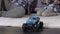 Boy playing with radio control car home, fathers birthday present, giving five