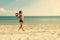 Boy playing and running ball of valleyball at the sea beach