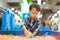 A boy is playing science sand at the playground