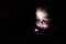 Boy playing with small flashlight