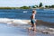 Boy playing in the surf