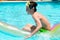 Boy playing in swimming pool