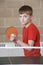 Boy Playing Table Tennis In School Gym
