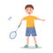 A boy plays badminton