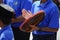 Boy plays kompang during Malay traditional wedding ceremony.