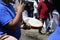 Boy plays kompang during Malay traditional wedding ceremony.