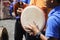 Boy plays kompang during Malay traditional wedding ceremony.