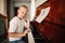 Boy plays piano at home