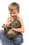 Boy Plays Veterinarian with Cat