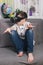 Boy plays with virtual reality glasses, indoors. Digital virtual reality device