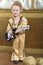 Boy in pop retro suit playing the guitar