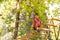 Boy portrait on sky rope suspended tree bridge