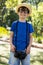 Boy posing with a camera around his neck