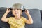 A boy with a pot on his head. Childhood, cook