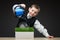 Boy pouring home model and green grass