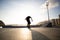 Boy practicing skateboarding during the sunset