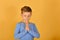 A boy prays kneeling, religious and devout children