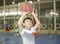 Boy preparing for basketball shooting at sports field