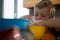 Boy preparing food in yellow container