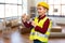 boy in protective helmet with hammer nailing nail