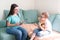 Boy in a psychologist`s office. Psychologist talking to a child