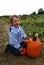 Boy in pumpkin field