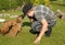 Boy and puppy 6 weeks old, playing