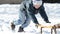 Boy pushing sled