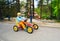 The boy quickly riding a four-wheeled bike in Park .