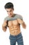 Boy raising his shirt showing abdominal on white background