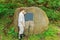 Boy reading sign on boulder