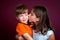 Boy Recoils From His Older Sister Who Is Kissing Him