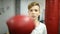 Boy in red boxing gloves beats