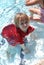 Boy in red in pool