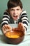 Boy refuse from eating smashed pumpkin soup