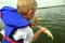 Boy Releasing Walleye