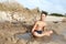 Boy resting on beach of Azov sea