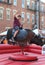 Boy Rides Mechanical Bull at Mexican Street Festival in Chicago