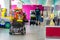 Boy is riding a small car through the shopping center. Cheboksary, Russia, 2018/08/20