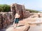 Boy rinsing off sea sand at an outdoor shower