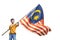 Boy rising malaysian flag with pride
