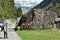 A boy with rucksack at the start of tourist path towards to Murg lakes